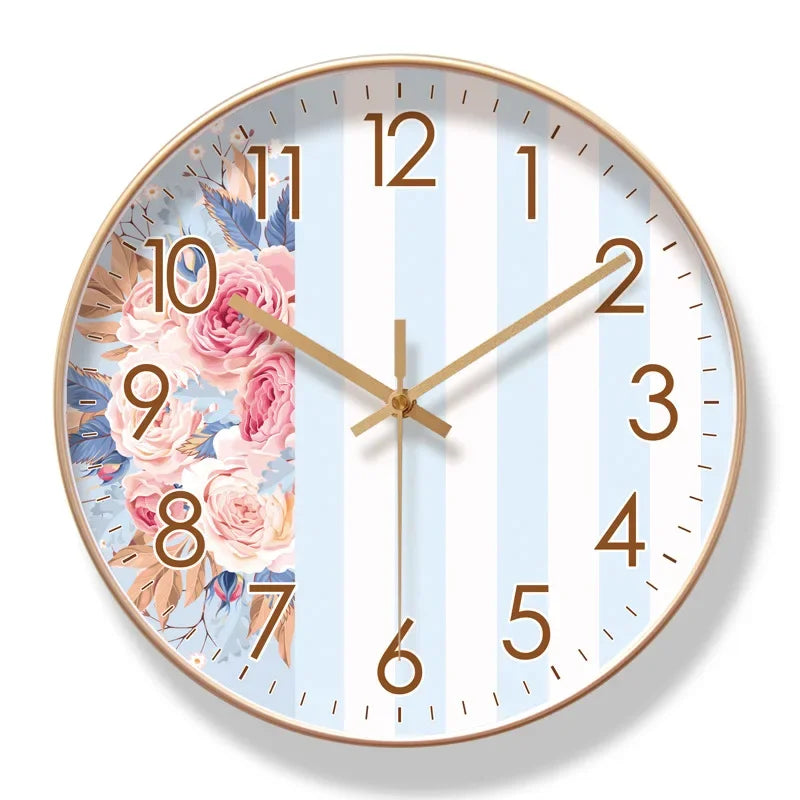 Round wall clock with floral design and gold casing on a white background


