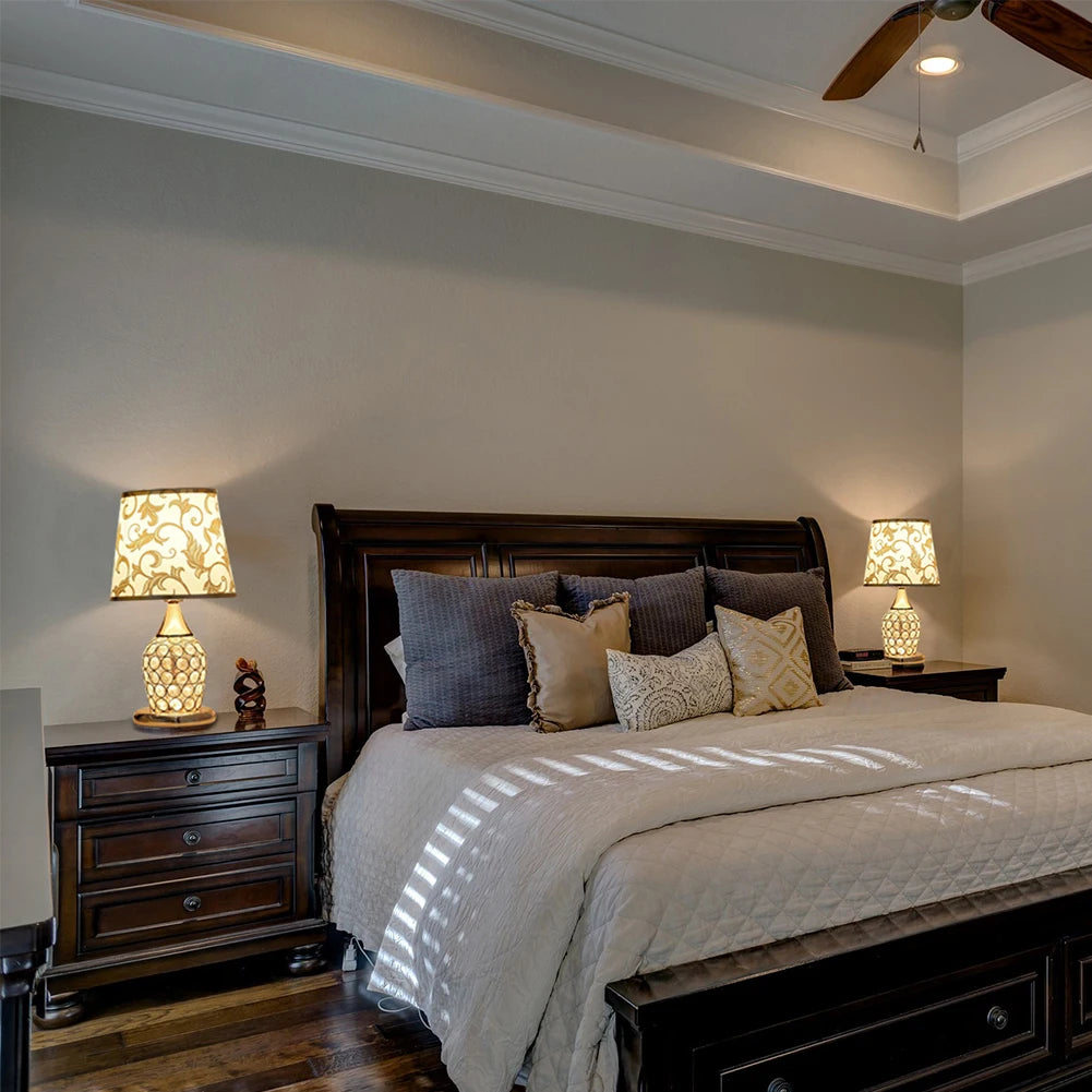 Bedroom with wooden bed, nightstands, and lamps.

