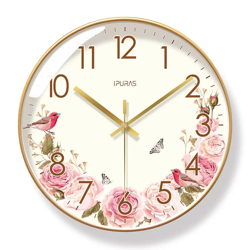Decorative wall clock with floral design and pink birds on a white background

