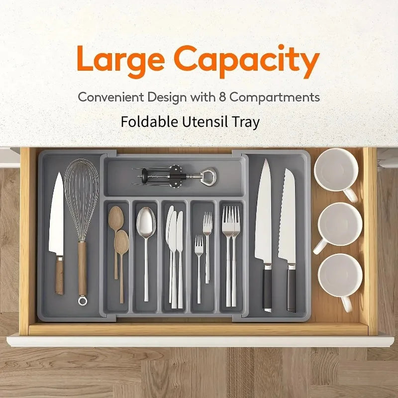 Foldable utensil tray with 8 compartments containing kitchen utensils and cups on a wooden surface.

