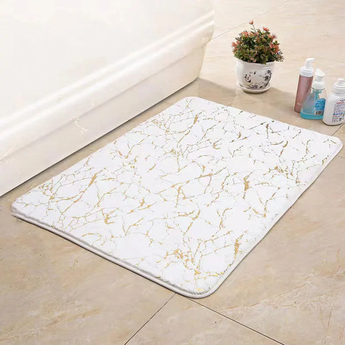 Marble-patterned rug on a tiled floor with cleaning supplies in the background

