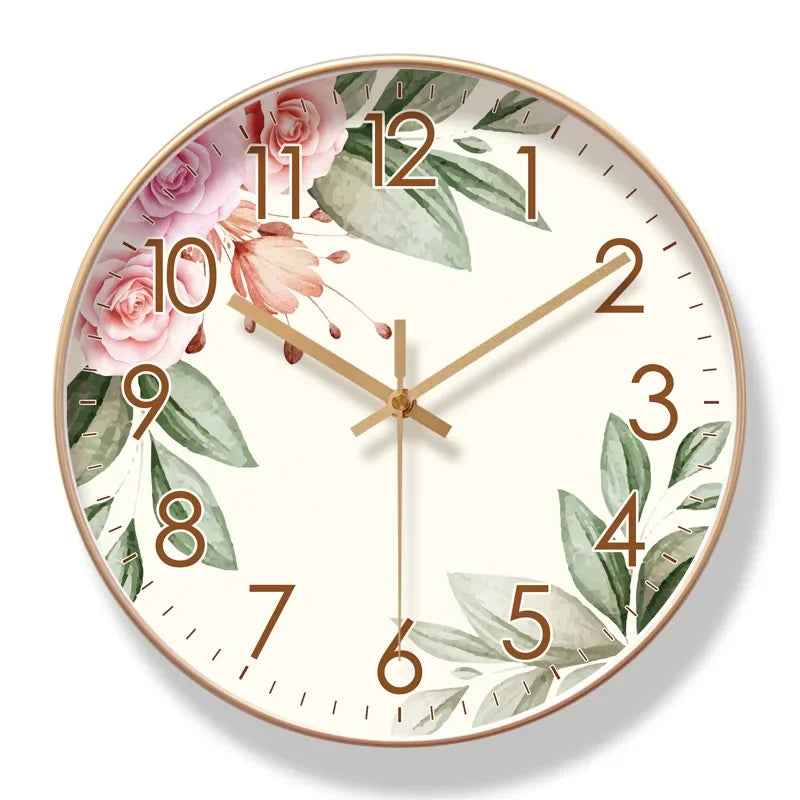 Decorative wall clock with floral and leaf design on a white background

