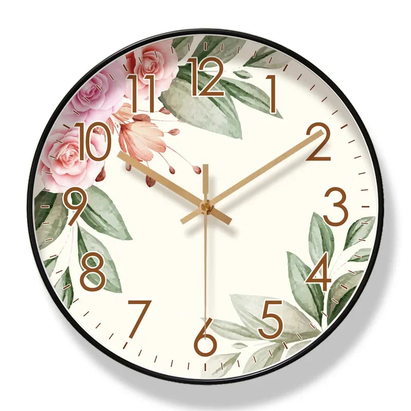 Decorative wall clock with floral and leaf design on a white background

