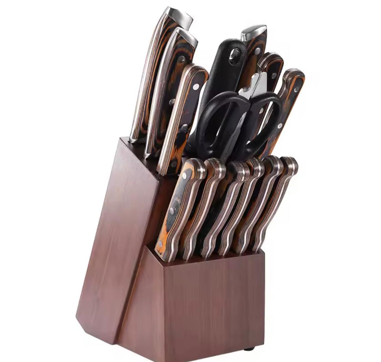 A kitchen knife block set with multiple stainless steel knives, black-handled kitchen shears, and a dark brown wooden block on a plain white background.


