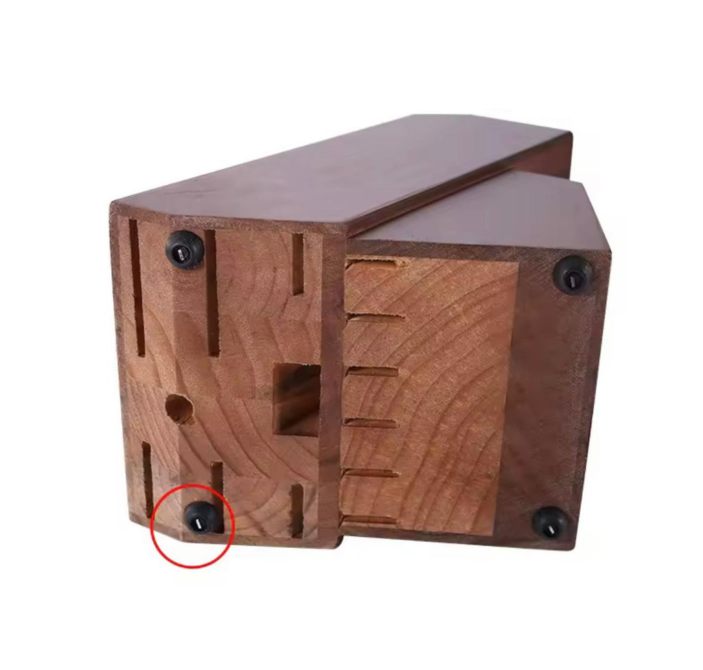 A reddish-brown wooden block or bracket with pre-drilled slots and four black screws, shown on a plain white background with one screw circled in red.

