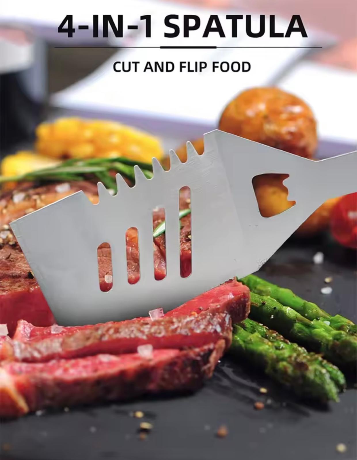 A stainless steel 4-in-1 spatula shown in use on a black skillet with sliced steak, green asparagus, and a potato. The text at the top reads '4-IN-1 SPATULA' and 'CUT AND FLIP FOOD'.

