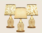 decorative table lamps with gold-toned bases 