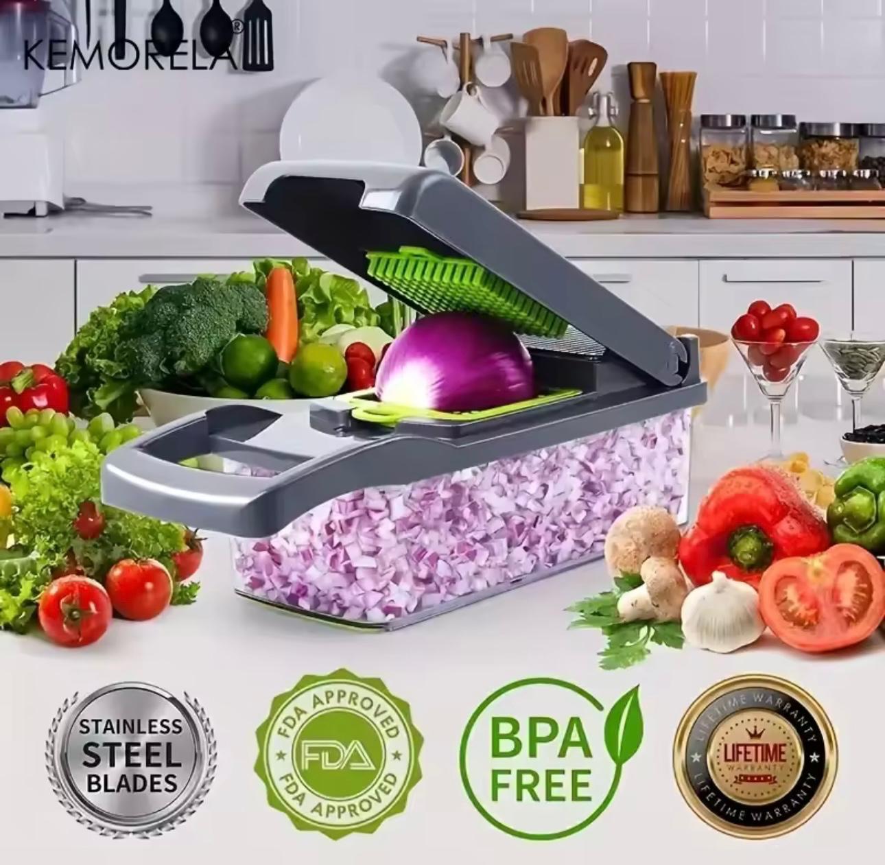 A kitchen countertop scene showing a KEMORELA manual food chopper with a translucent container filled with chopped purple onions, plus fresh vegetables around it. The chopper lid is open, and the image includes marketing badges at the bottom for stainless steel blades, FDA approved, BPA free, and lifetime warranty.

