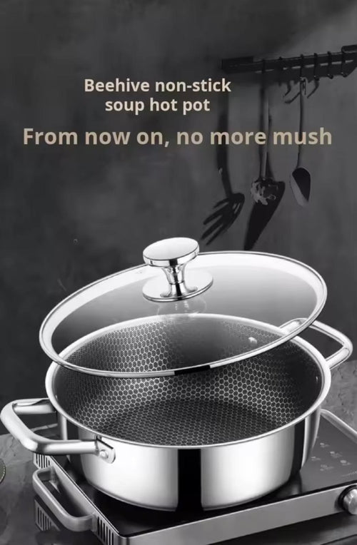 A stainless steel soup hot pot with a glass lid and a perforated inner pot, shown on a stovetop against a dark kitchen background with hanging utensils. Text at the top reads 'Beehive non-stick soup hot pot' and 'From now on, no more mush'.


