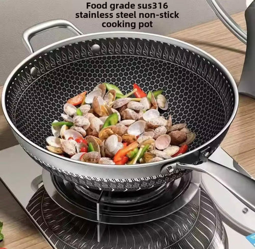 A stainless steel non-stick cooking pot with a textured honeycomb-style interior, shown on a stovetop with clams and vegetables cooking inside. Text at the top reads 'Food grade sus316 stainless steel non-stick cooking pot.

