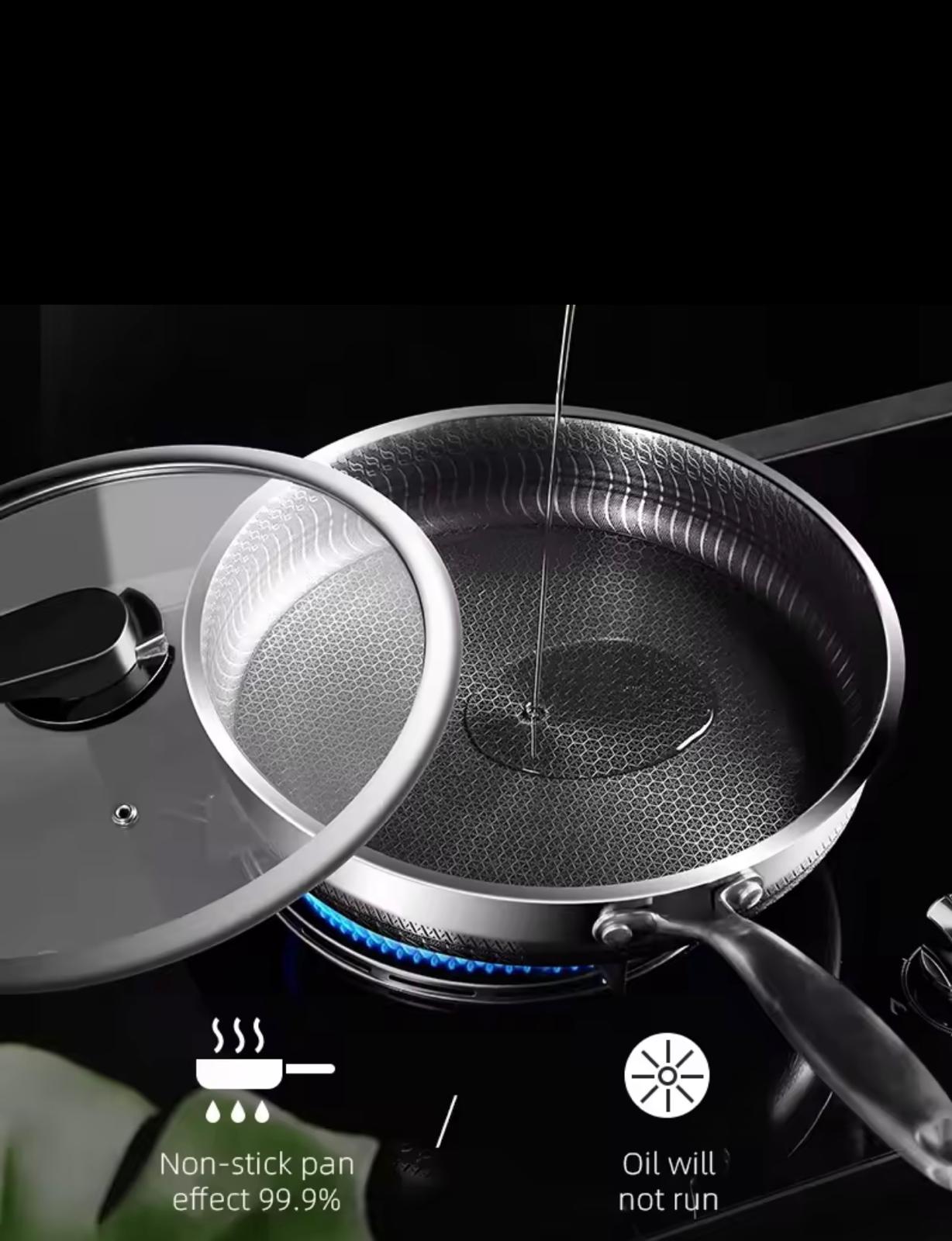 A stainless steel frying pan with a textured non-stick surface and a glass lid, shown on a black stovetop with blue flame. Oil is being poured into the pan, with text overlays highlighting non-stick performance and oil containment.

