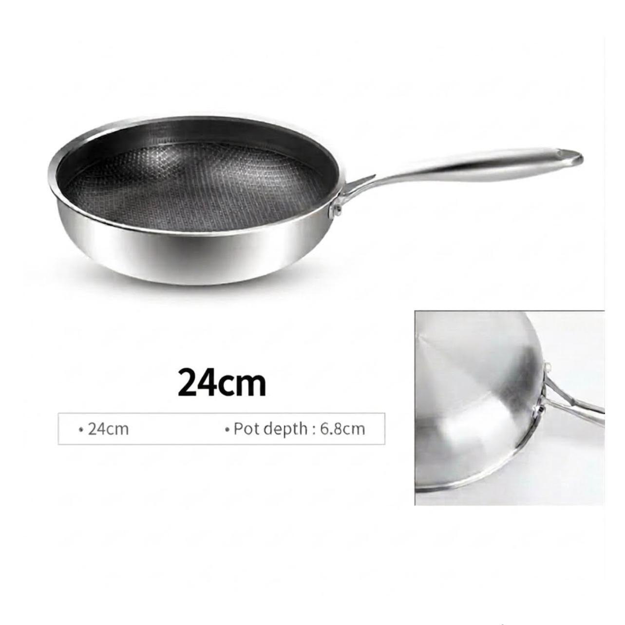 A stainless steel frying pan with a textured non-stick interior, shown on a white background with text indicating 26cm size and a small inset detail of the pot depth.


