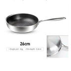 A stainless steel frying pan with a textured non-stick interior, shown on a white background with text indicating 26cm size and a small inset detail of the pot depth.

