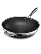 A 32cm tri-ply hybrid wok with a black honeycomb-textured non-stick interior and a silver stainless steel exterior, shown on a clean white background.

