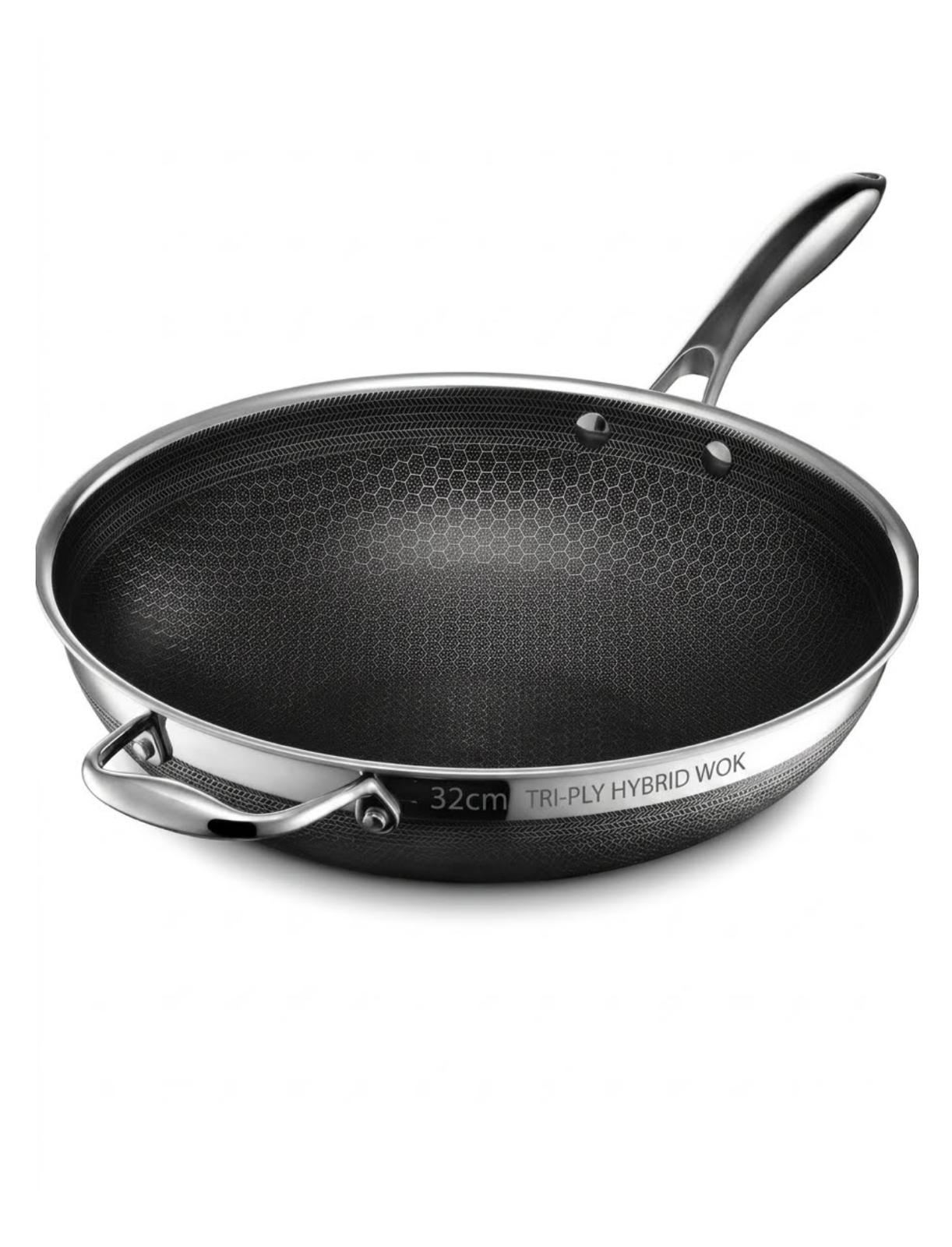 A 32cm tri-ply hybrid wok with a black honeycomb-textured non-stick interior and a silver stainless steel exterior, shown on a clean white background.

